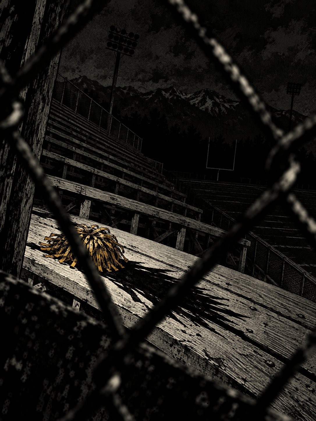 An empty high school football field at night seen through a chain-link fence, a gold pom-pom left on the bleachers